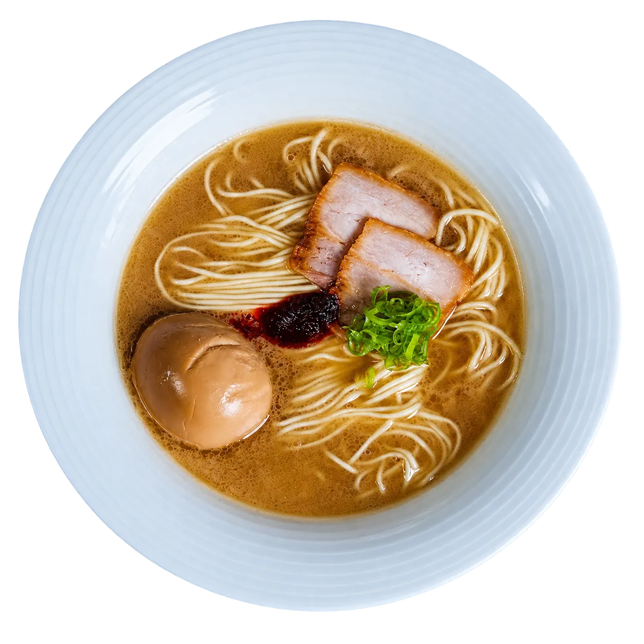 Premium tonkotsu ramen: pork chashu, ajitama, negi and house red chili spice