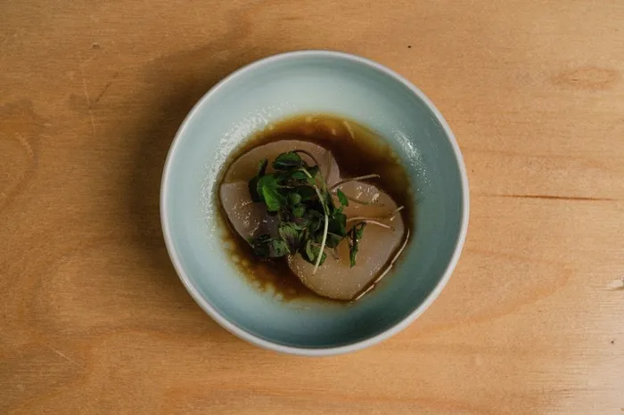 Scallop crudo with Hokkaido scallops, truffle soy and micro shiso